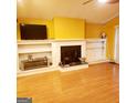 Living room features a fireplace and built in shelving at 6709 Biscayne Blvd, Rex, GA 30273
