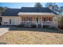 House exterior with front porch and landscaping at 165 Nandover Way, Fayetteville, GA 30215