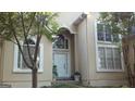Front entrance of a two story house with white door and arched windows at 190 Oakwood Lakes Dr, Hampton, GA 30228