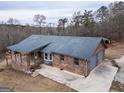 Charming brick home with a spacious two-car garage and covered porch, offering comfort and curb appeal at 3505 Gum Creek Rd, Oxford, GA 30054