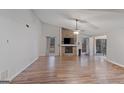 Spacious living room with a stone fireplace and a ceiling fan at 210 Imad Ct, Fairburn, GA 30213
