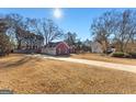 House with driveway and yard, located on a tree-lined street at 110 Bailey Ct, Fayetteville, GA 30215