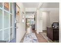 Bright and spacious entryway with view of living room at 1480 Trellis Court (Lot 42), Hampton, GA 30228