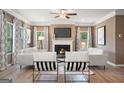 Cozy living room featuring a fireplace and ample natural light at 1480 Trellis Court (Lot 42), Hampton, GA 30228