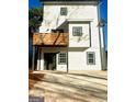 Rear view of two-story home, highlighting the deck and backyard at 1279 Allene Sw Ave, Atlanta, GA 30310
