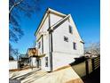 White two-story home with a side view showcasing a deck and backyard at 1279 Allene Sw Ave, Atlanta, GA 30310