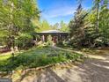 House exterior showcasing a stone pathway and lush greenery at 500 Augusta Ln, Chattahoochee Hills, GA 30268