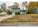 Two-story house with a brick facade and a paved driveway at 2994 Meadow Wood Ct, Lawrenceville, GA 30044