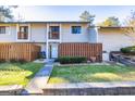 Front view of a two-story townhouse with a walkway and small lawn at 172 Twiggs Cor, Peachtree City, GA 30269