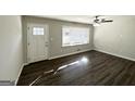 Bright living room featuring hardwood floors and a classic aesthetic at 4785 Kent Rd, Atlanta, GA 30337