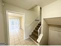 Bright entryway with staircase leading to the upper level at 2318 Emerald Falls Dr, Decatur, GA 30035