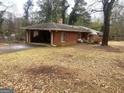 Brick house with carport and fenced backyard at 5865 Ridge Se Dr, Mableton, GA 30126