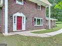 Red front door and brick facade at 3031 Golden Dr, East Point, GA 30344