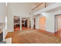 Open floor plan living room with hardwood floors and high ceilings at 5539 Halsey Trce, Atlanta, GA 30349