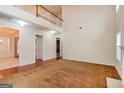 Two-story living room with hardwood floors and high ceilings at 5539 Halsey Trce, Atlanta, GA 30349