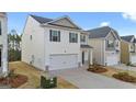 Well-maintained two-story home with a two-car garage in a residential neighborhood at 12029 Conrad Circle, Hampton, GA 30228