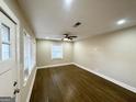Bright living room with hardwood floors and neutral color palette at 1996 Meadow Ln, Decatur, GA 30032