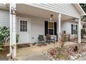 Covered front porch with seating at 304 Slaughter Rd, Hampton, GA 30228