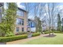 Charming brick house featuring well-maintained landscaping, a gravel path, and inviting curb appeal at 147 Hubbard Rd, Woodstock, GA 30188