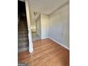 Bright entryway with hardwood floors and staircase at 1030 Chase Ln, Mcdonough, GA 30253