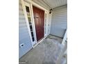 Front entrance with a burgundy door and sidelights at 1030 Chase Ln, Mcdonough, GA 30253