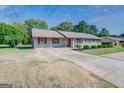 Ranch home with carport and spacious yard at 463 Conyers Rd, Mcdonough, GA 30253