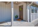 Inviting front door with porch and potted plants at 463 Conyers Rd, Mcdonough, GA 30253