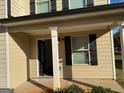 Front entrance with columns, door, and sidelights at 385 Mcgiboney Ln, Covington, GA 30016