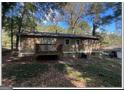 Back of house showing a deck and wooded area at 3798 Adkins Nw Rd, Atlanta, GA 30331