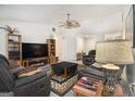 Spacious living room with stylish furnishings, a ceiling fan, and an open layout for modern living at 546 Paden Dr, Lawrenceville, GA 30044