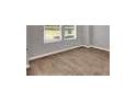 Interior room with brown flooring and white baseboards at 5324 Tolar Rd # 28, South Fulton, GA 30213