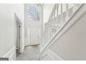 Two-story entryway with a staircase and large window at 9507 Byrom Rd, Jonesboro, GA 30236