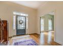 Hardwood floors, neutral walls, and a view of the living room and staircase at 960 Todd Dr, Covington, GA 30014