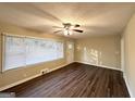 Spacious living area with hardwood floors and large window at 2780 Mitchell Dr, Decatur, GA 30032