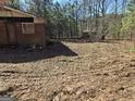 Brick house on a cleared lot with trees in the background at 8025 Creekwood Dr, Fairburn, GA 30213