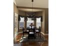 Cozy breakfast nook with bay window and chandelier at 100 Harmony Ct, Dallas, GA 30157