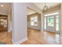 Bright and spacious entryway with hardwood floors and views to the kitchen at 65 Oakhurst Trl, Sharpsburg, GA 30277