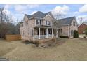 Brick home with attached garage and front porch, set on a spacious lot at 25 Abelia Dr, Covington, GA 30014