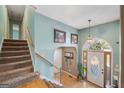 Inviting foyer featuring hardwood floors, staircase, and arched doorway at 232 Taylors Farm Dr, Canton, GA 30115