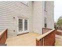 Wooden deck with railing, leading to backyard at 504 Serene Waters Trl, Jonesboro, GA 30236