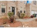 Front entry with steps leading to a covered porch at 504 Serene Waters Trl, Jonesboro, GA 30236