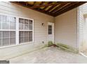 Small covered patio with access from the back of the house at 504 Serene Waters Trl, Jonesboro, GA 30236