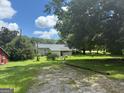 Charming home with a spacious yard, a serene setting, and a detached garage at 1597 Highway 92 S, Fayetteville, GA 30215