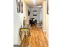 Long hallway with hardwood floors and elegant decor at 6356 Hickory Lane Cir, Union City, GA 30291