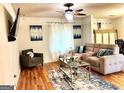 Comfortable living room featuring hardwood floors and neutral decor at 6356 Hickory Lane Cir, Union City, GA 30291