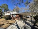 Side view of brick ranch home with carport at 730 N Carter Dr, Jonesboro, GA 30236