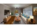 Bright living room with hardwood floors and comfy furniture at 730 N Carter Dr, Jonesboro, GA 30236