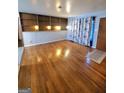 Living room with hardwood floors and built-in shelving at 485 Evergreen Dr, Forest Park, GA 30297