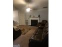 Living room featuring a fireplace and comfortable seating at 2658 Deann Dr, Ellenwood, GA 30294