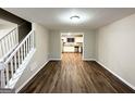 Bright dining room with hardwood floors and a view of the kitchen at 3880 Springleaf Ct, Stone Mountain, GA 30083